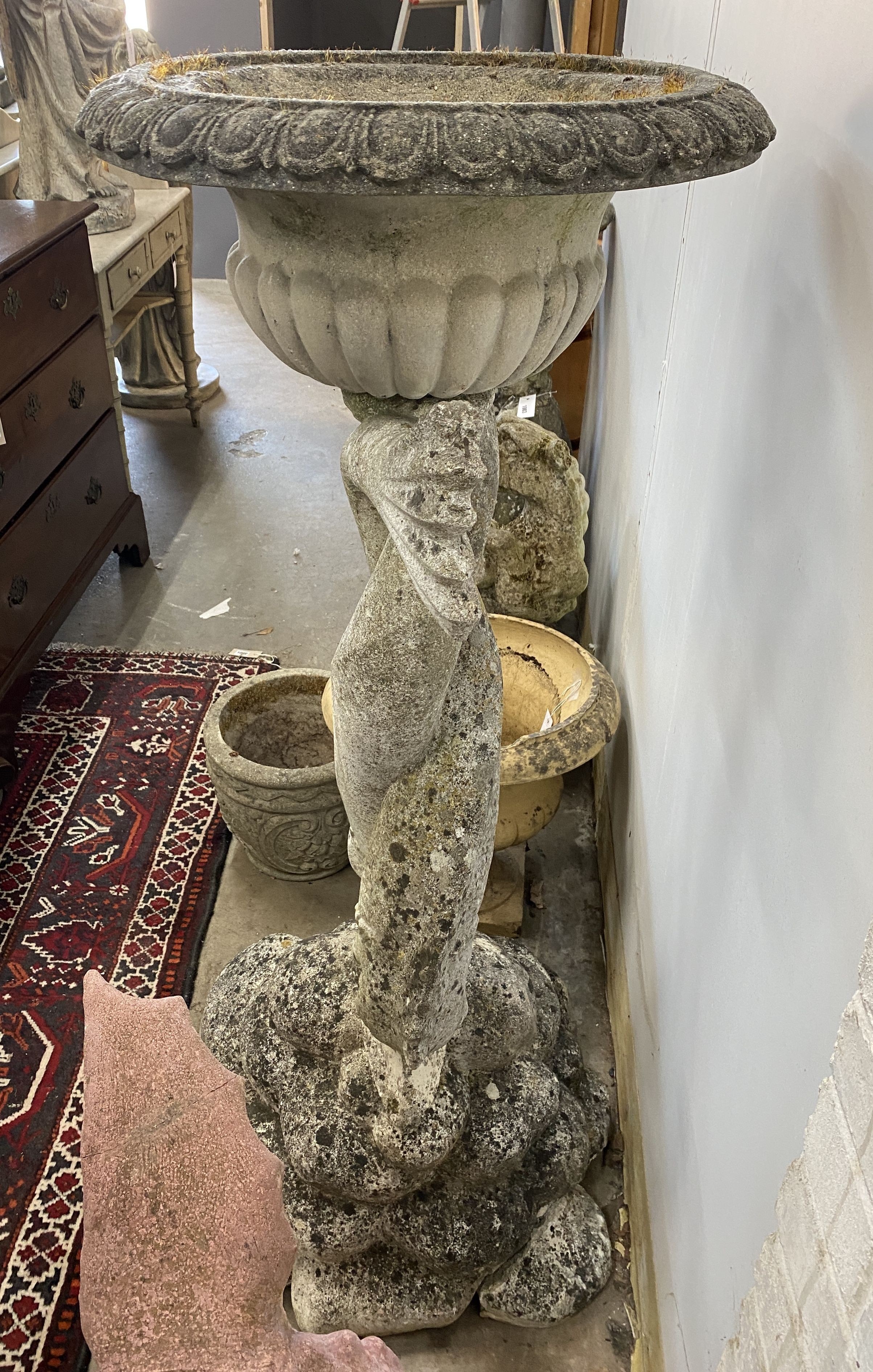 A large reconstituted stone dolphin garden planter, height 132cm